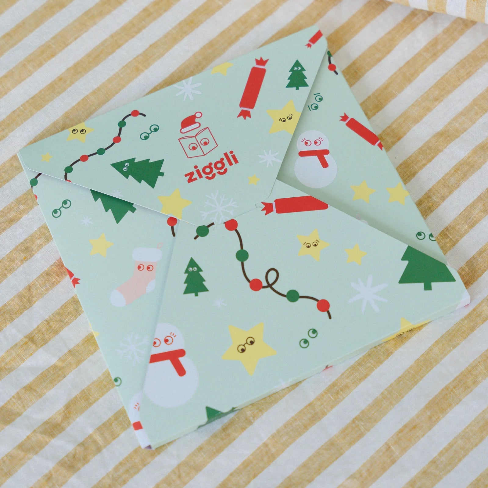 Ziggli Christmas gift wrap extras with festive red and green patterns, perfect for wrapping holiday presents.