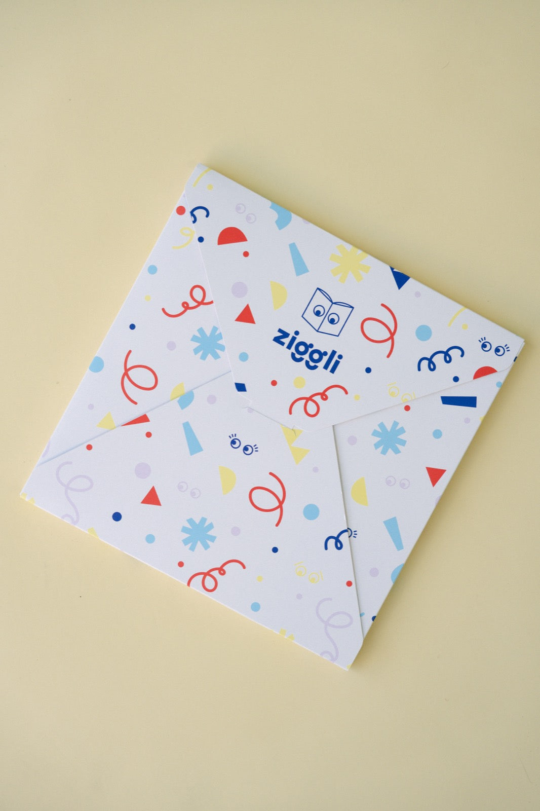 Ziggli birthday confetti flatlay with blank personalised book mockup