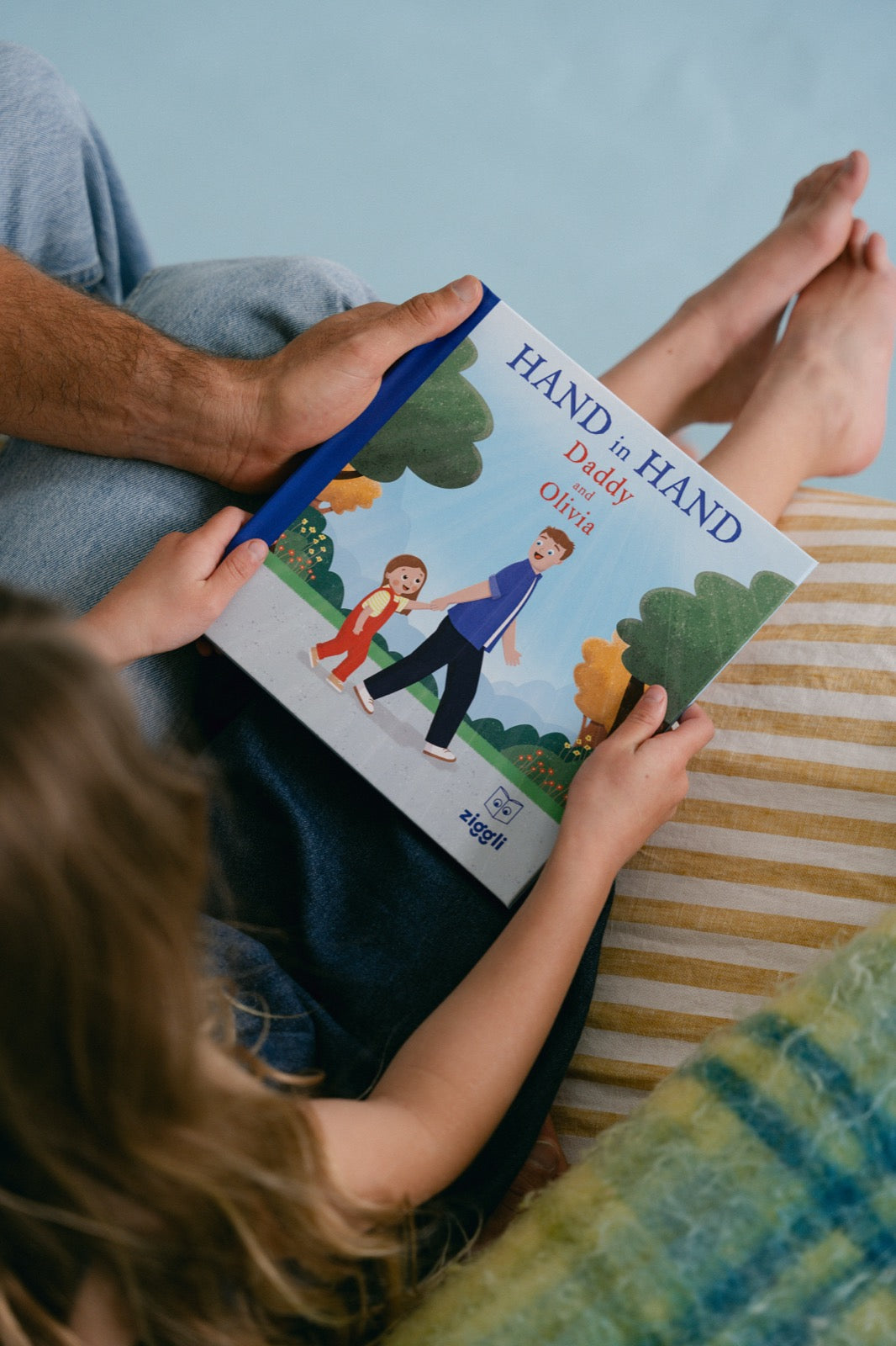 Hand in Hand personalised book cover held by dad and daughter