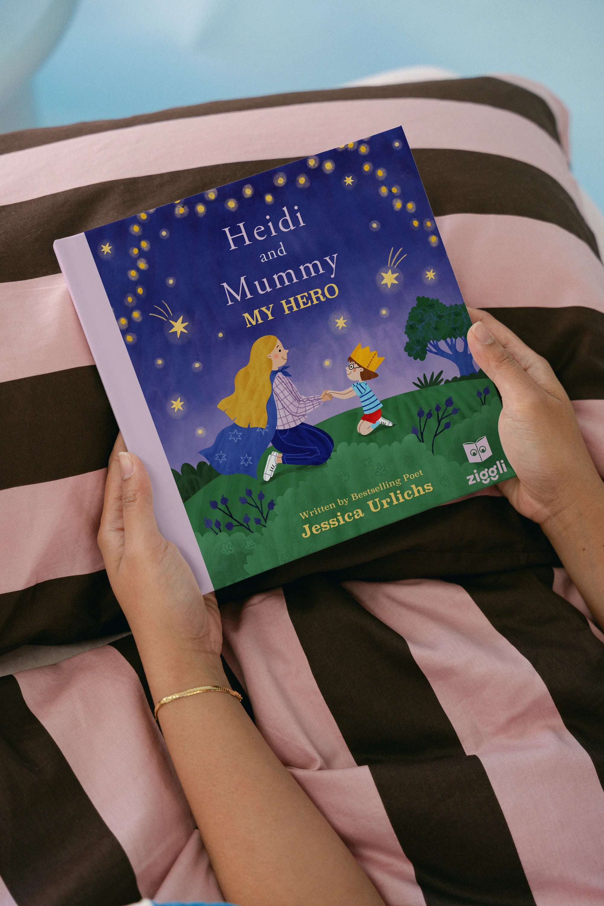 Cover image of the book "My Hero" by Ziggli, featuring colorful illustrations and a child holding a superhero-themed book.
